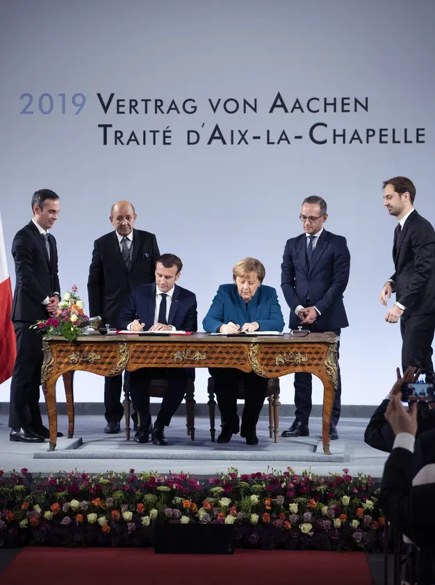 Angela Merkel und Emmanuel Macron bei der Unterzeichung des Vertrags von Aachen
